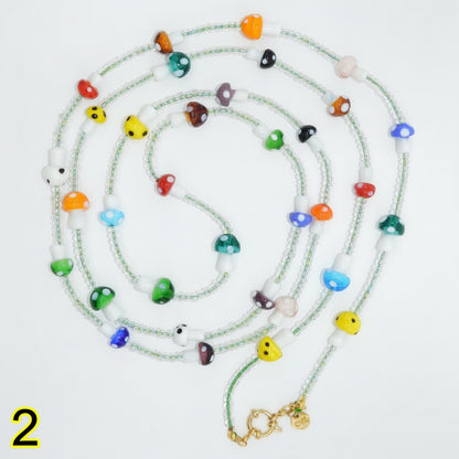 Colorful beaded necklace on a white background