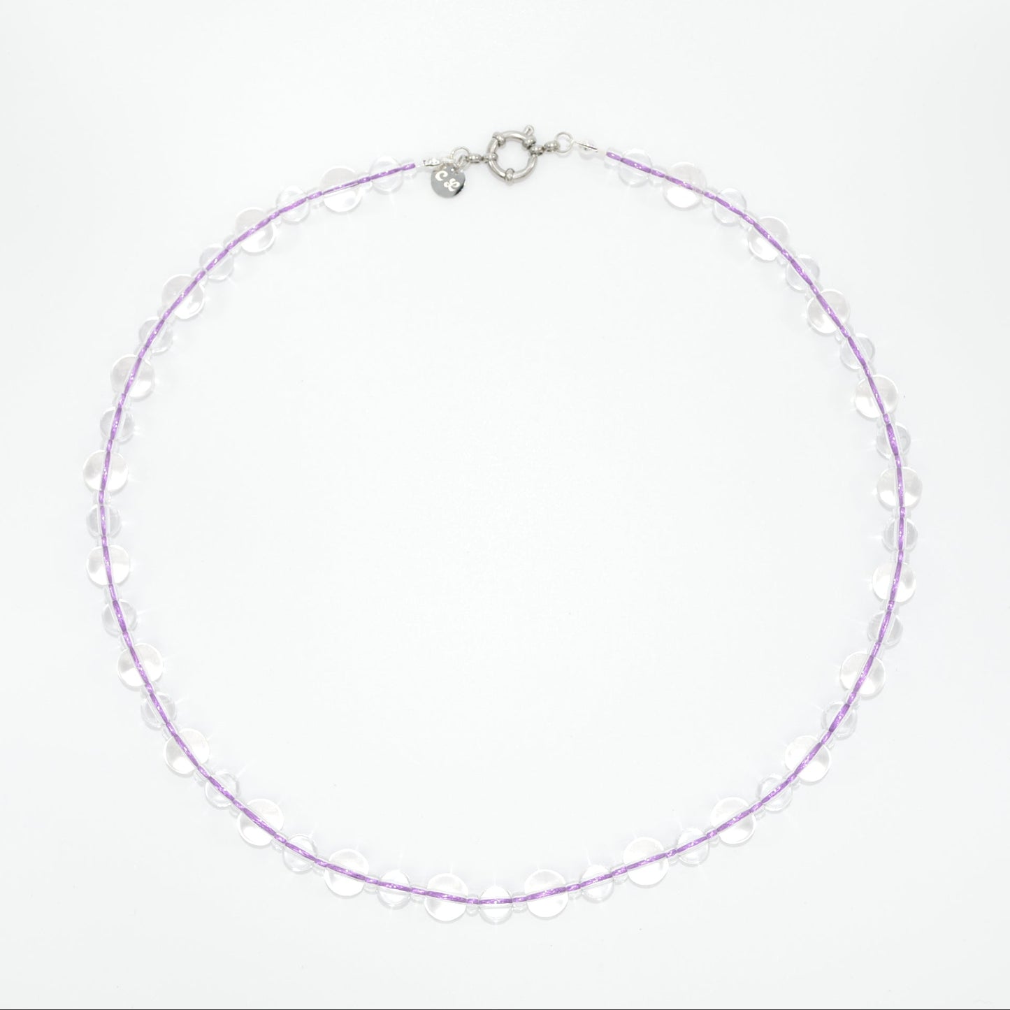 glass necklace with purple lace on a white background