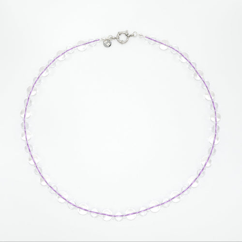 glass necklace with purple lace on a white background