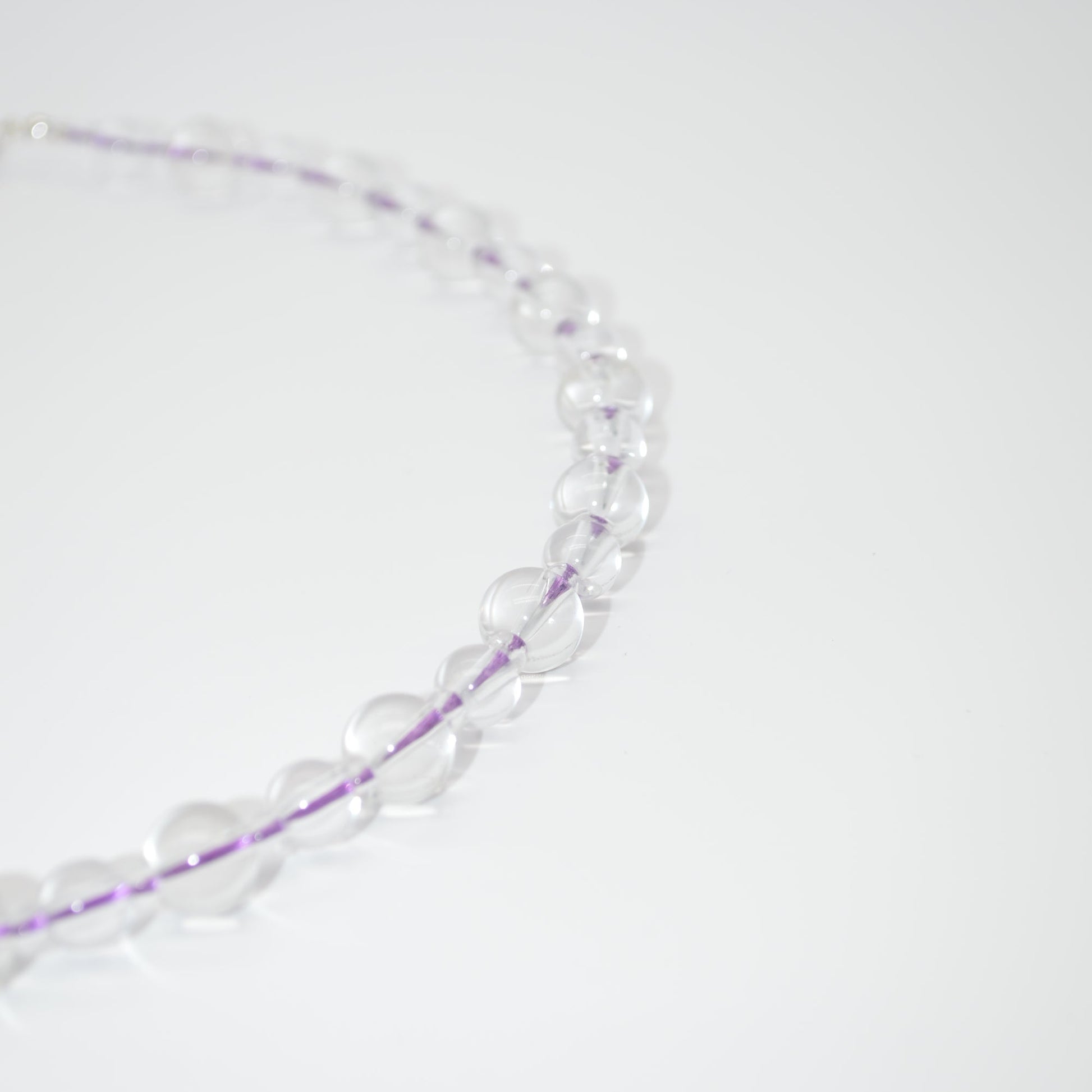 Necklace with clear beads on a white background