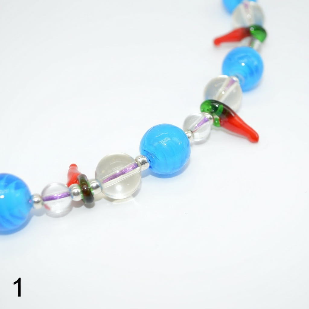 Colorful beaded necklace on a white background