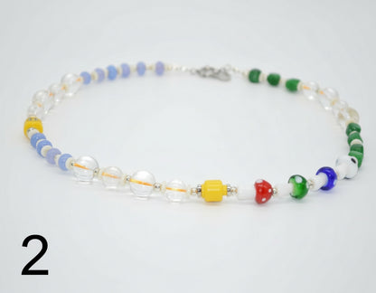 Colorful beaded necklace on a white background