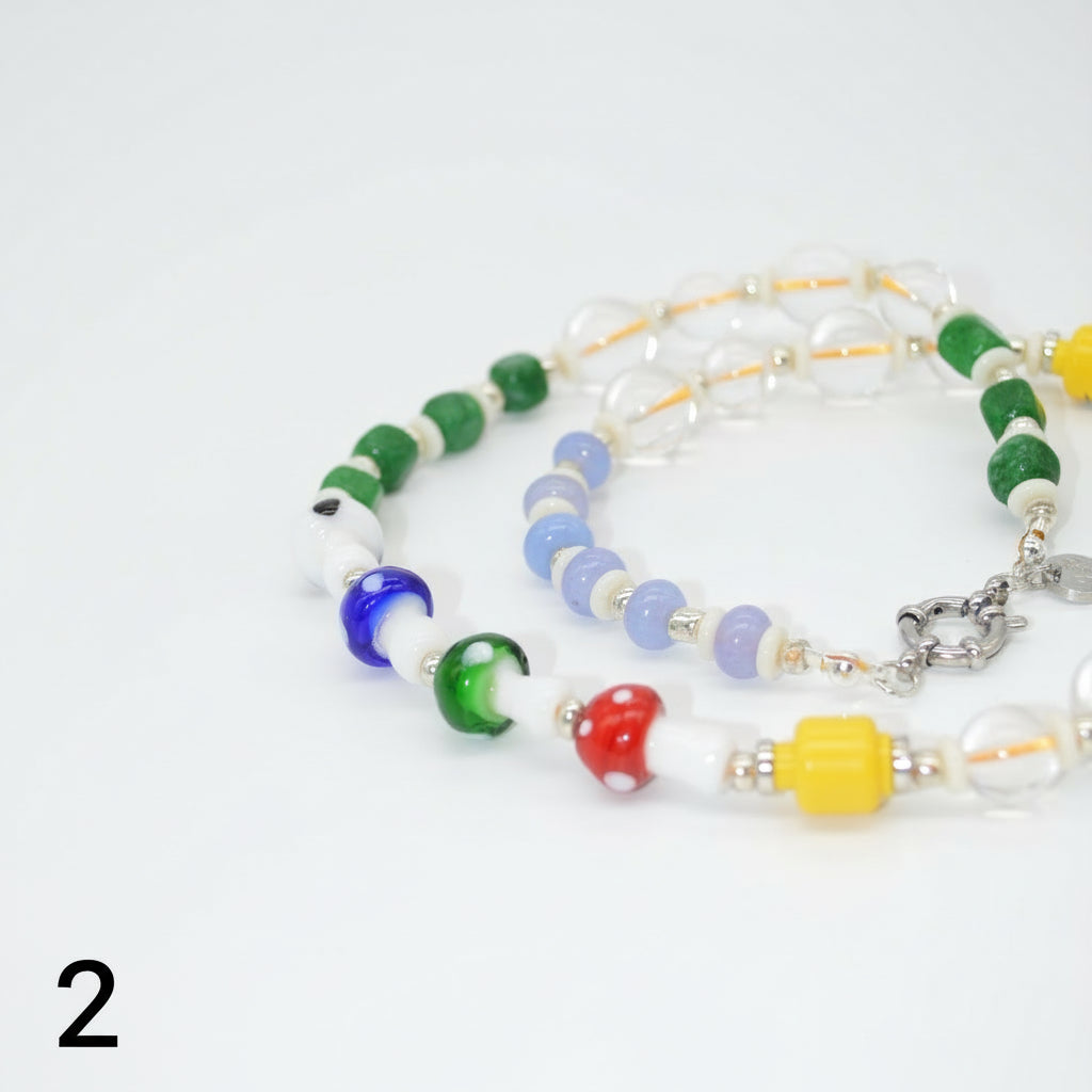 Colorful beaded bracelets on a white background
