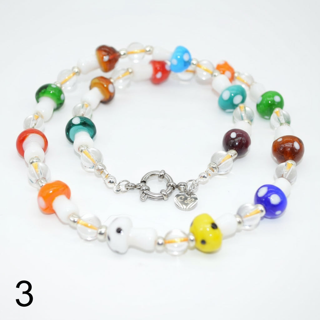 Colorful beaded necklace with a silver clasp on a white background