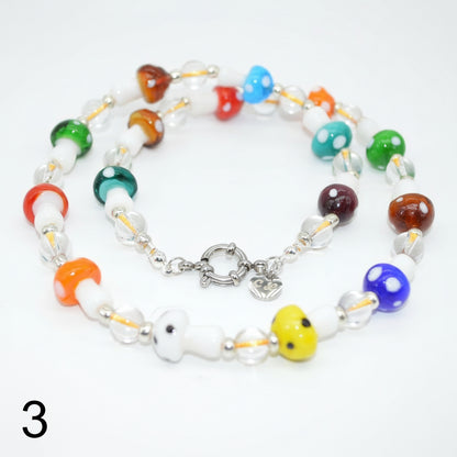 Colorful beaded necklace with a silver clasp on a white background