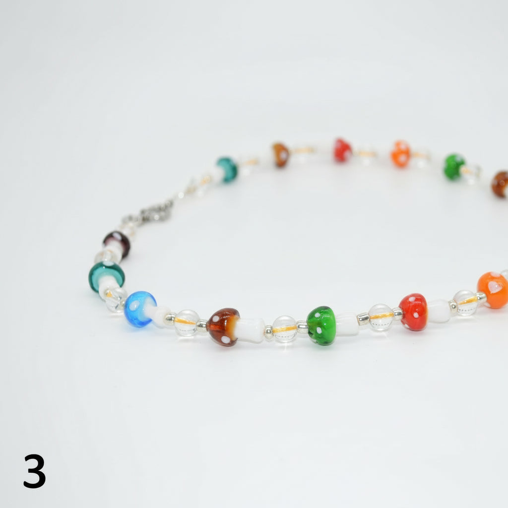 Colorful beaded necklace on a white background