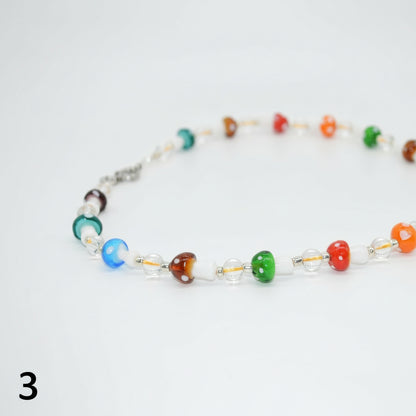 Colorful beaded necklace on a white background