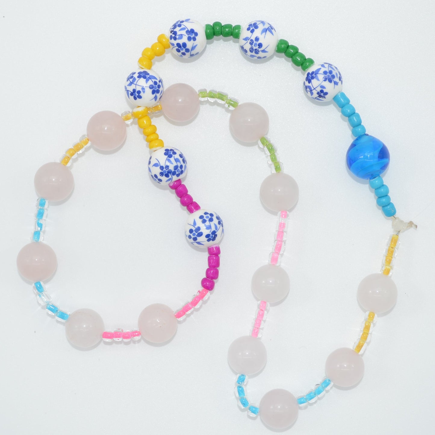 Colorful beaded necklace on a white background