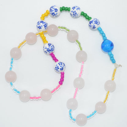 Colorful beaded necklace on a white background