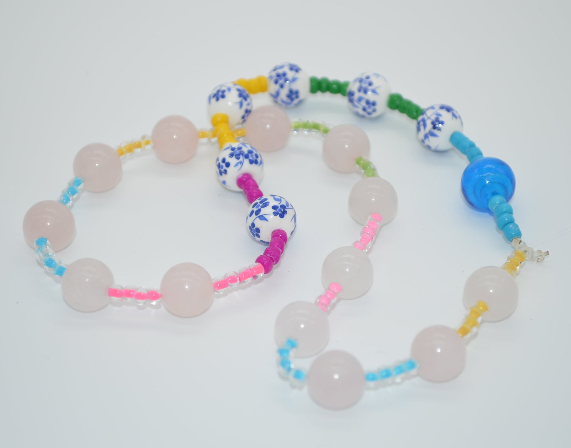 Colorful beaded necklace on a white background