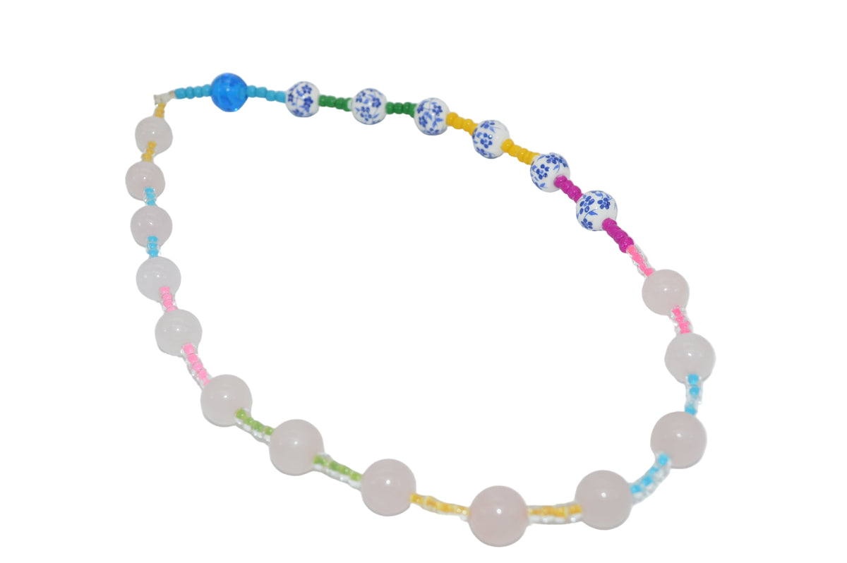 Necklace with colorful beads on a white background