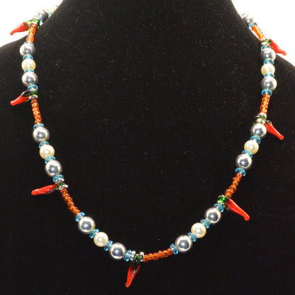 Colorful beaded necklace on a black velvet stand