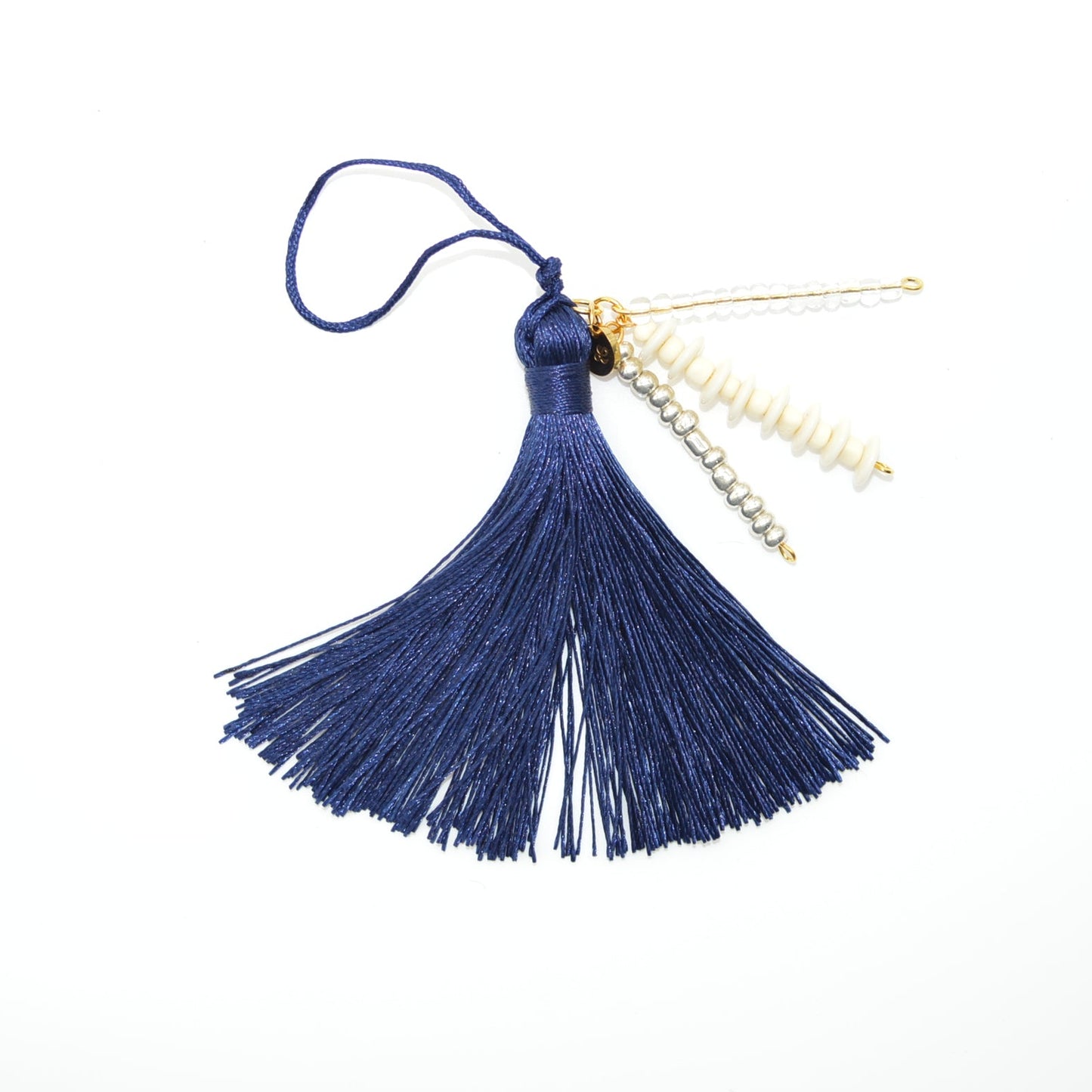 Blue tassel with gold beads on a white background