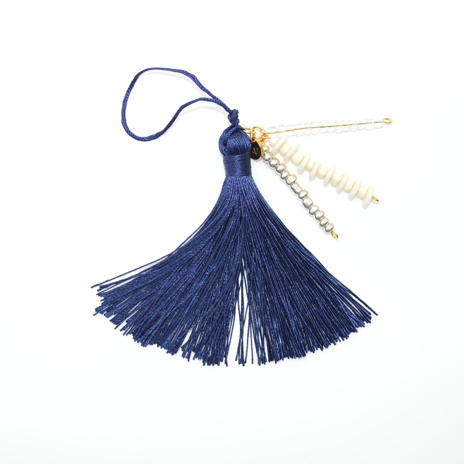Blue tassel with gold beads on a white background
