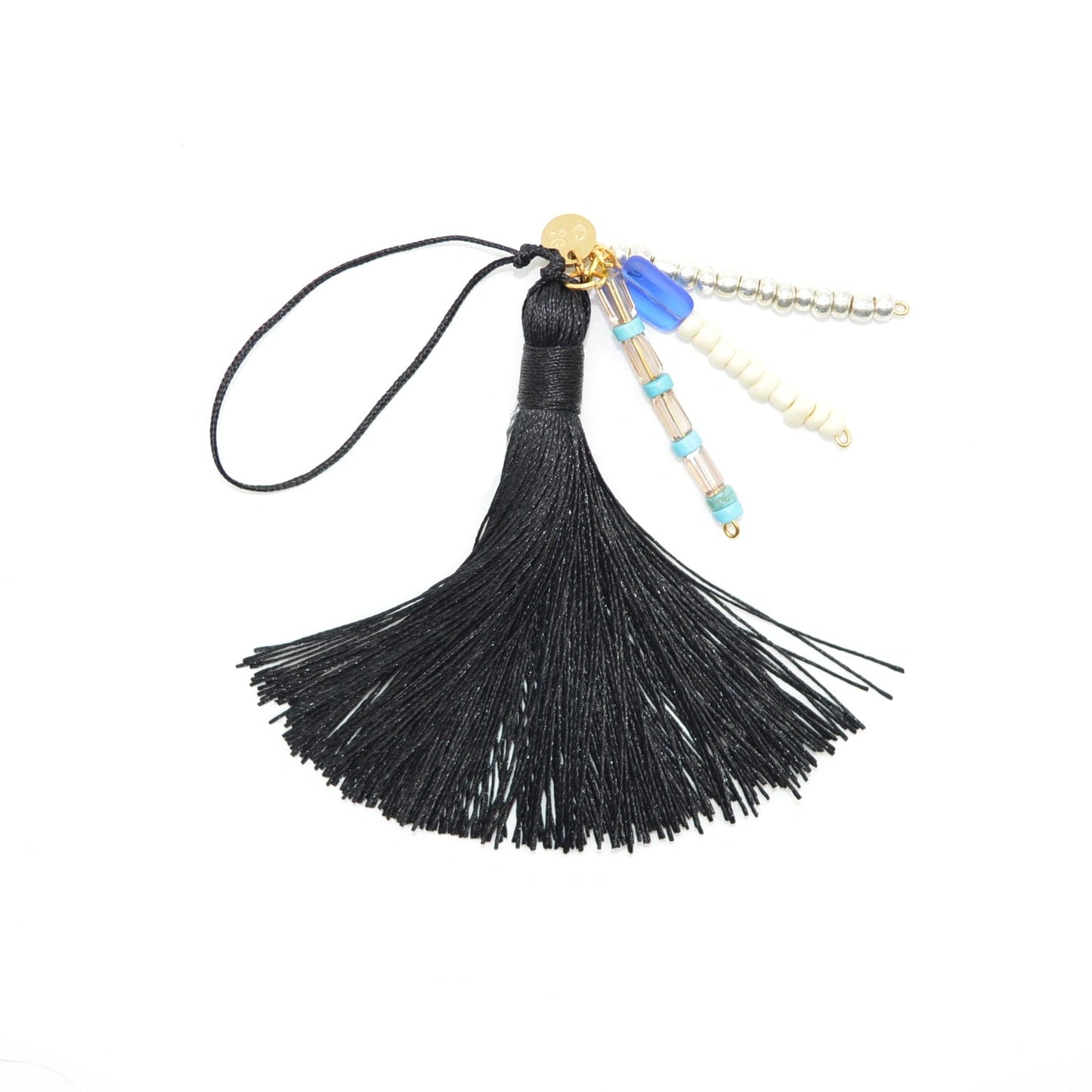 Black tassel charm with beads on a white background