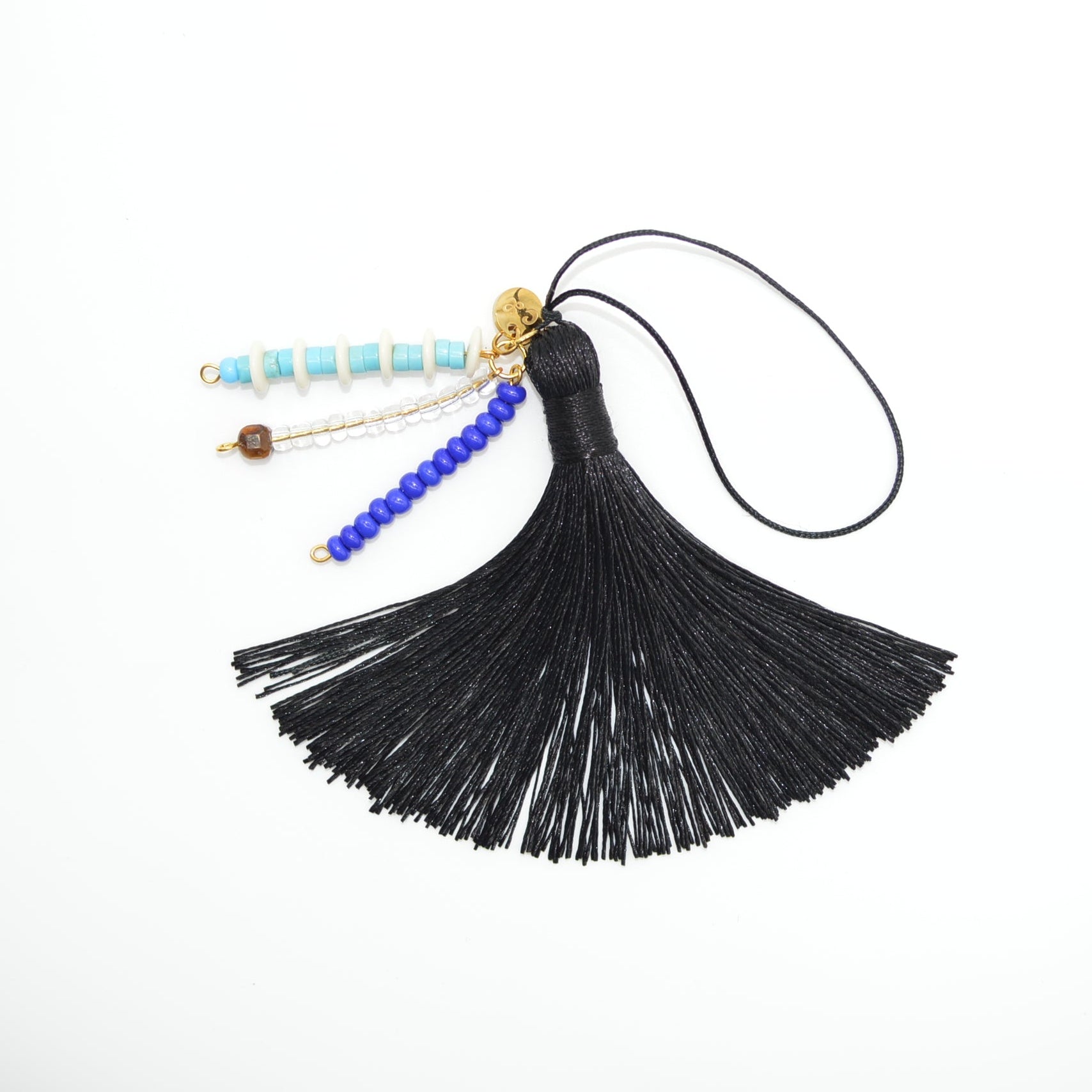 Black tassel with beads on a white background
