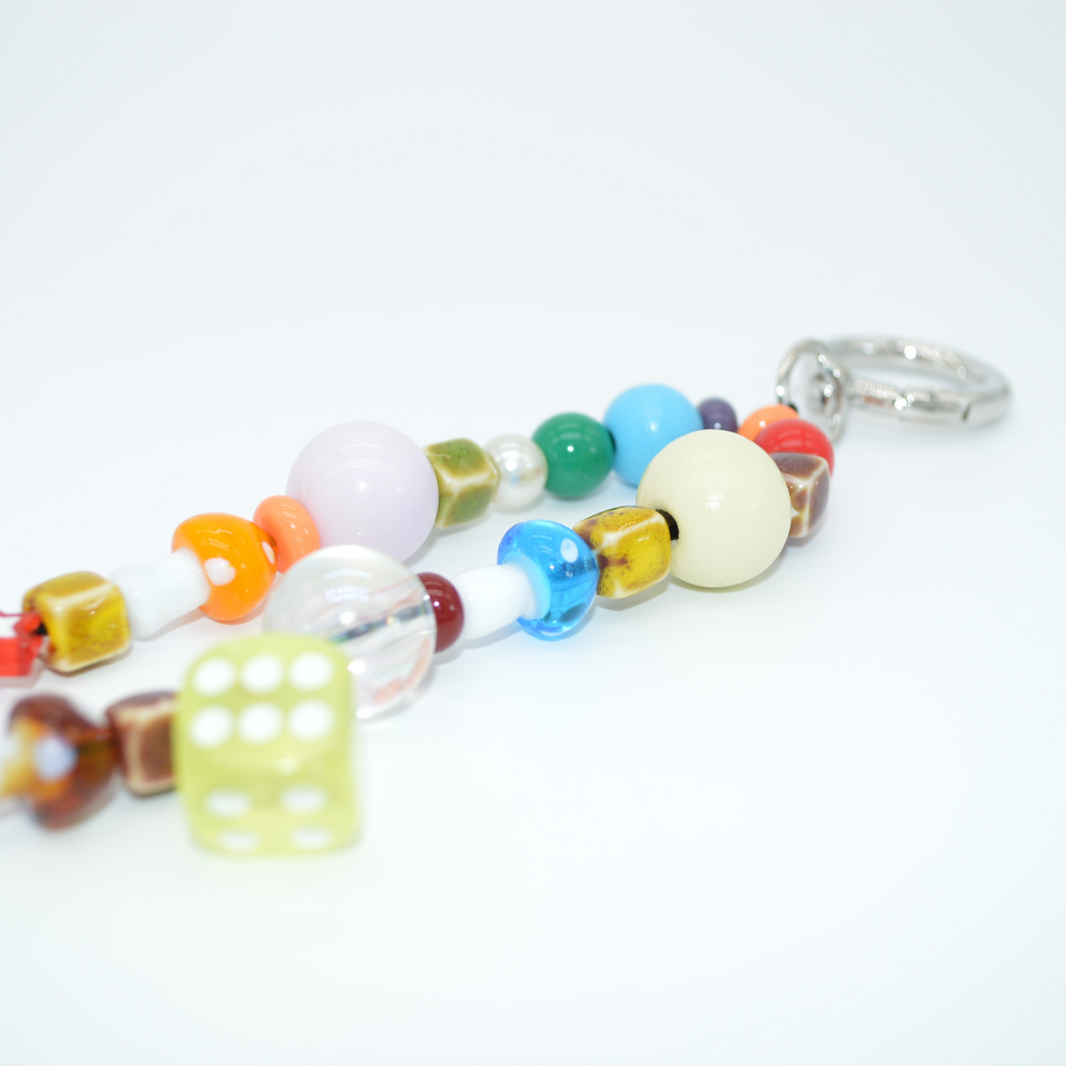 Colorful beaded keychain with a metal clasp on a white background